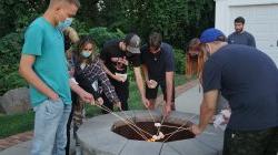 Students roasting marshmallows